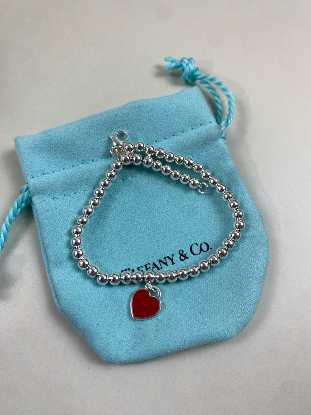 Tiffany & Co. Silver Bead Bracelet with Red Heart Pendant